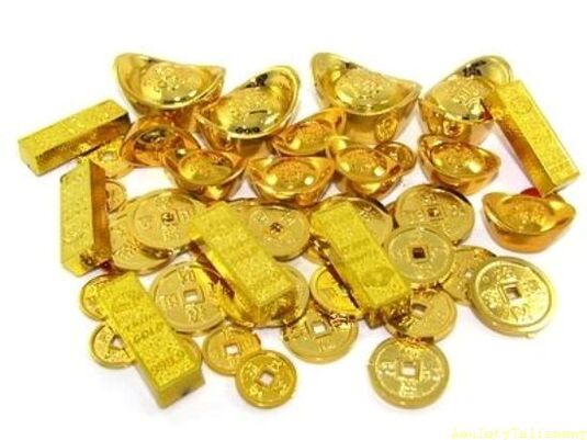 Goldbarren und Münzen als Glücksbringer